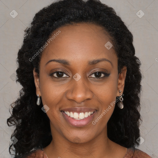 Joyful black young-adult female with long  black hair and brown eyes