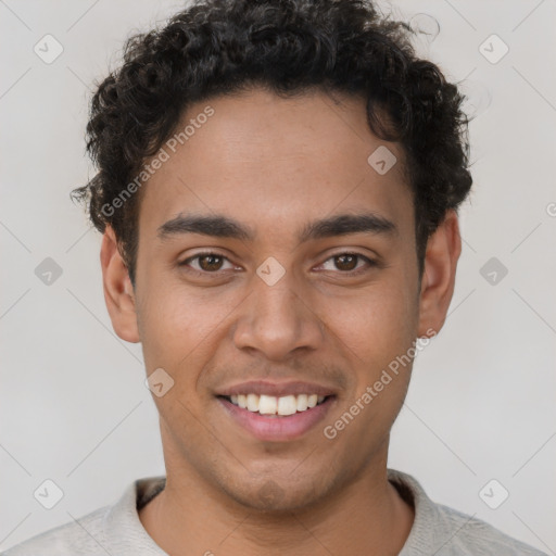 Joyful latino young-adult male with short  brown hair and brown eyes