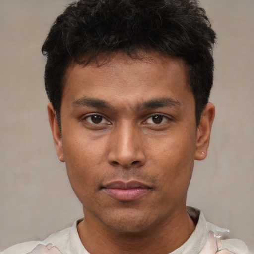 Neutral latino young-adult male with short  black hair and brown eyes