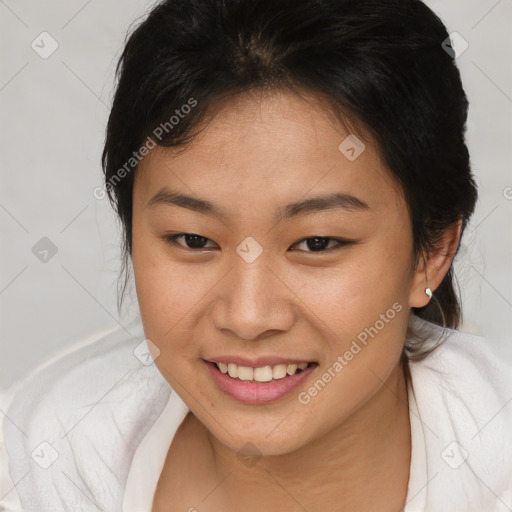 Joyful asian young-adult female with medium  brown hair and brown eyes