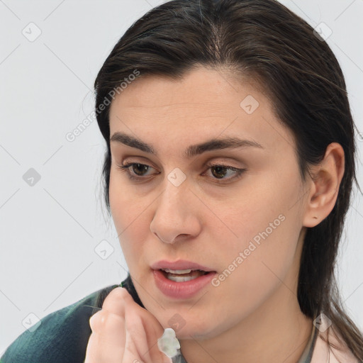 Joyful white young-adult female with medium  brown hair and brown eyes