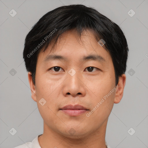 Neutral asian young-adult male with short  brown hair and brown eyes