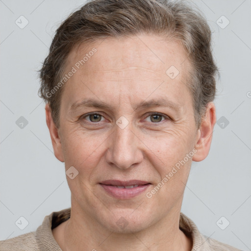 Joyful white adult male with short  brown hair and grey eyes