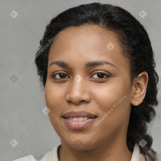 Joyful black young-adult female with medium  brown hair and brown eyes