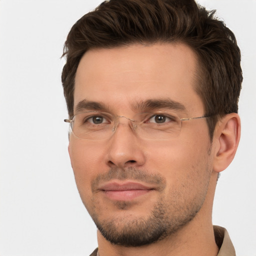 Joyful white adult male with short  brown hair and brown eyes