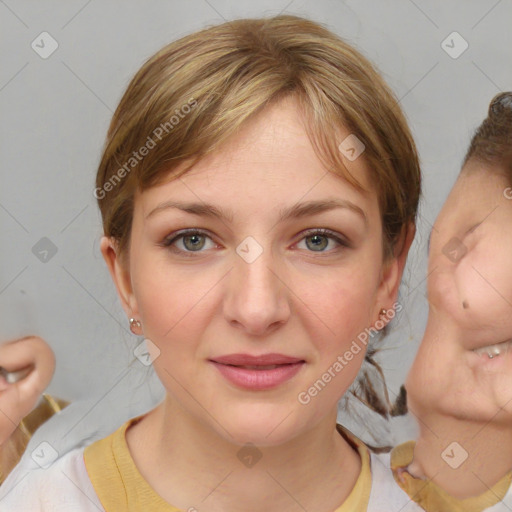 Joyful white young-adult female with medium  brown hair and grey eyes