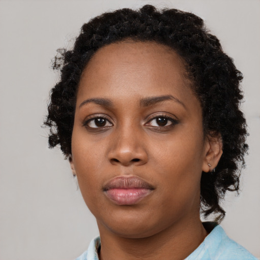 Neutral black young-adult female with long  black hair and brown eyes