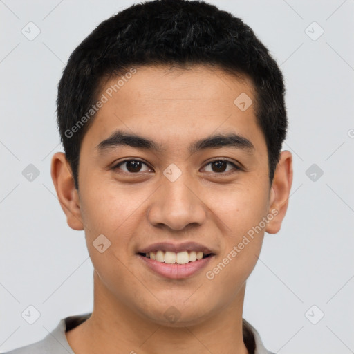 Joyful latino young-adult male with short  brown hair and brown eyes