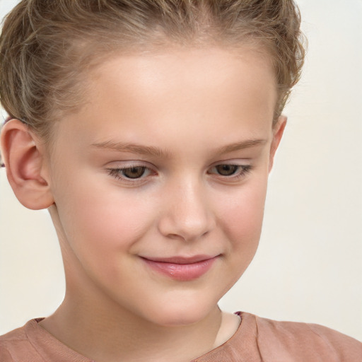 Joyful white child female with short  brown hair and brown eyes