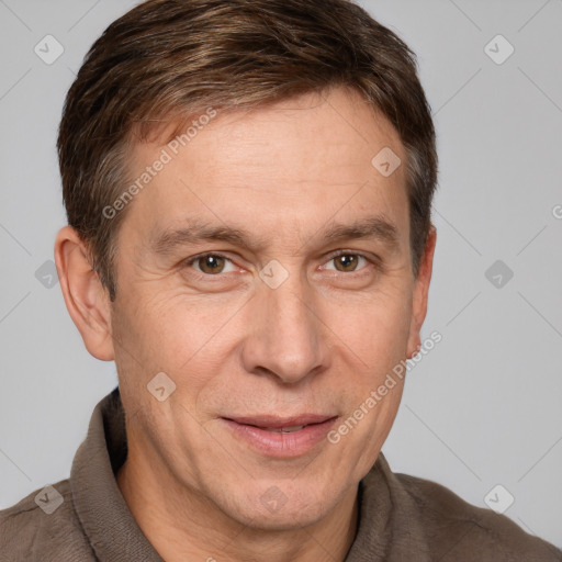 Joyful white adult male with short  brown hair and grey eyes