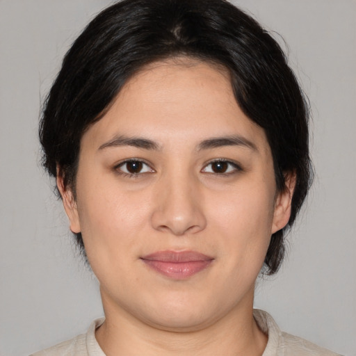 Joyful white young-adult female with medium  black hair and brown eyes