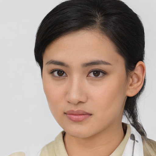 Neutral asian young-adult female with medium  brown hair and brown eyes