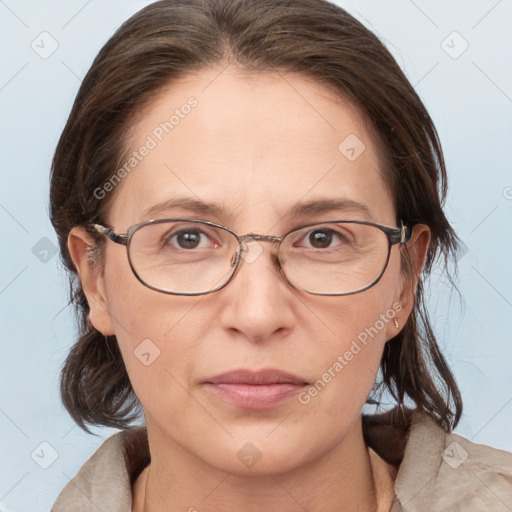 Joyful white adult female with medium  brown hair and grey eyes