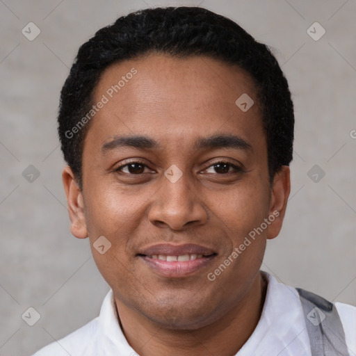 Joyful latino young-adult male with short  black hair and brown eyes