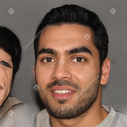 Joyful latino young-adult male with short  black hair and brown eyes