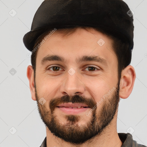 Joyful white young-adult male with short  black hair and brown eyes