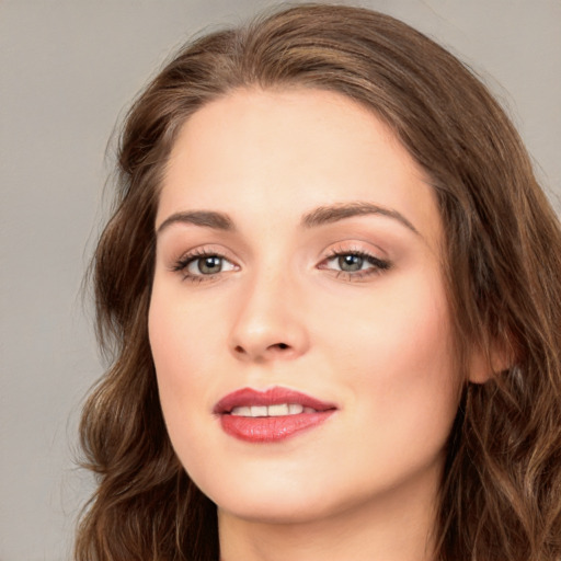 Joyful white young-adult female with long  brown hair and green eyes