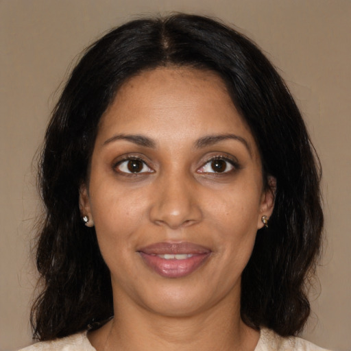 Joyful black young-adult female with medium  black hair and brown eyes
