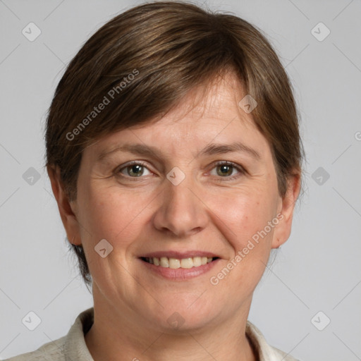 Joyful white adult female with medium  brown hair and grey eyes