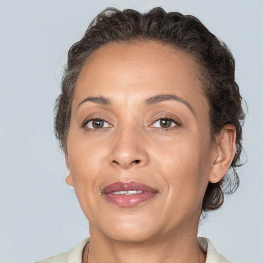 Joyful white adult female with short  brown hair and brown eyes