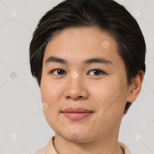 Joyful asian young-adult female with short  brown hair and brown eyes