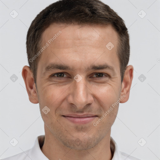 Joyful white adult male with short  brown hair and brown eyes