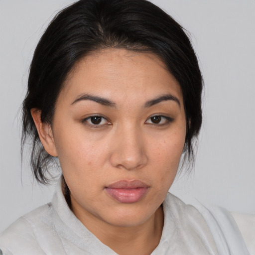 Neutral latino young-adult female with medium  brown hair and brown eyes