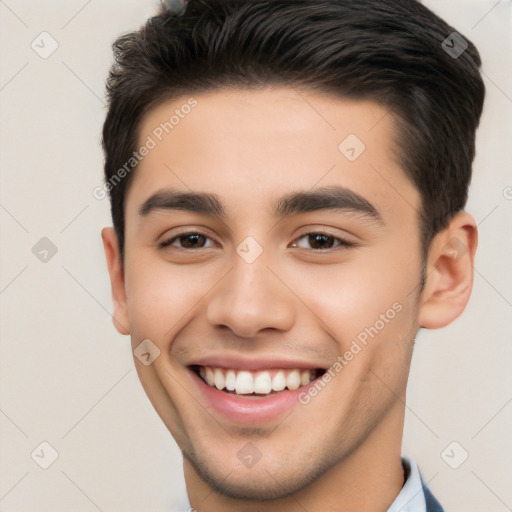 Joyful white young-adult male with short  black hair and brown eyes