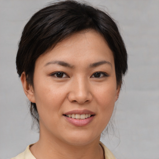 Joyful white young-adult female with medium  brown hair and brown eyes