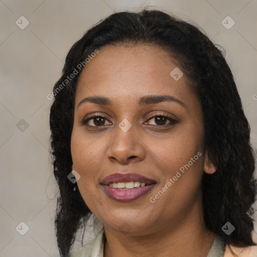 Joyful black adult female with medium  brown hair and brown eyes