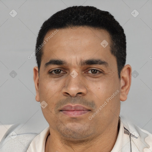 Neutral latino young-adult male with short  black hair and brown eyes