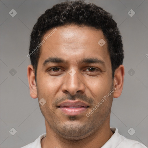 Joyful latino young-adult male with short  brown hair and brown eyes