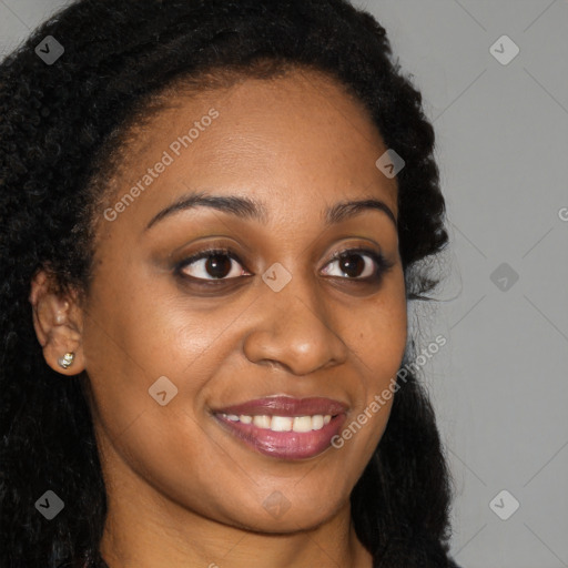 Joyful black young-adult female with long  brown hair and brown eyes