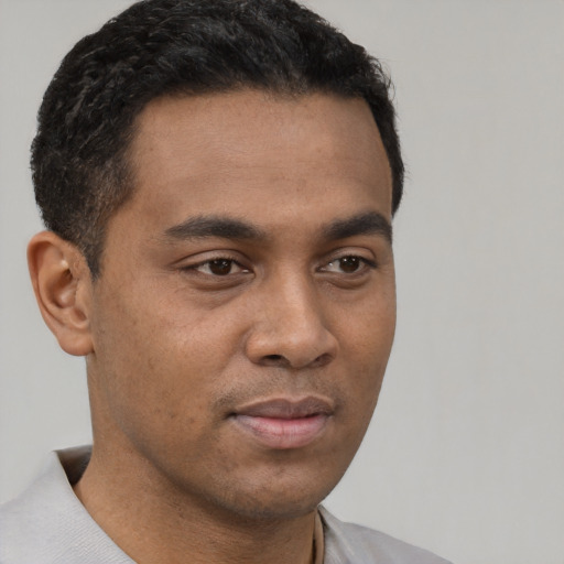 Neutral latino young-adult male with short  black hair and brown eyes