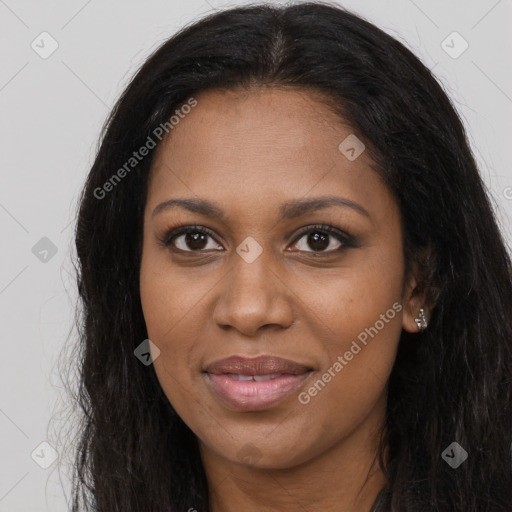 Joyful black young-adult female with long  brown hair and brown eyes