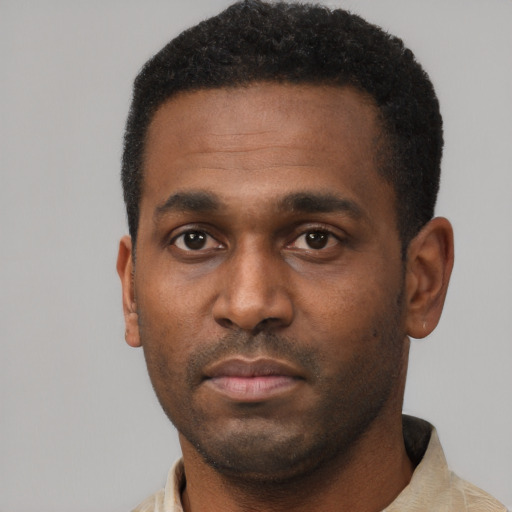 Neutral black young-adult male with short  black hair and brown eyes