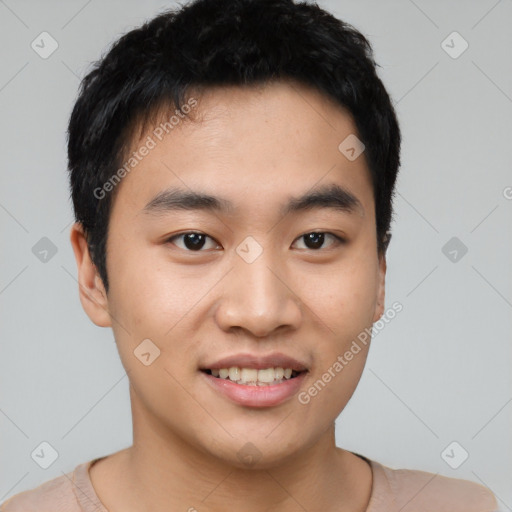 Joyful asian young-adult male with short  black hair and brown eyes