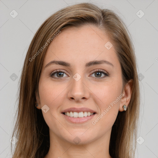 Joyful white young-adult female with long  brown hair and grey eyes