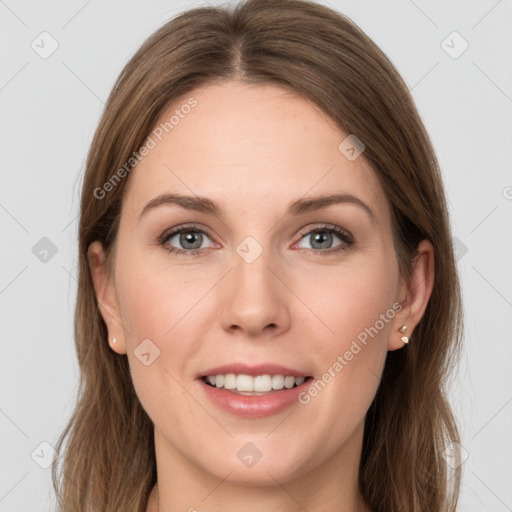 Joyful white young-adult female with long  brown hair and grey eyes