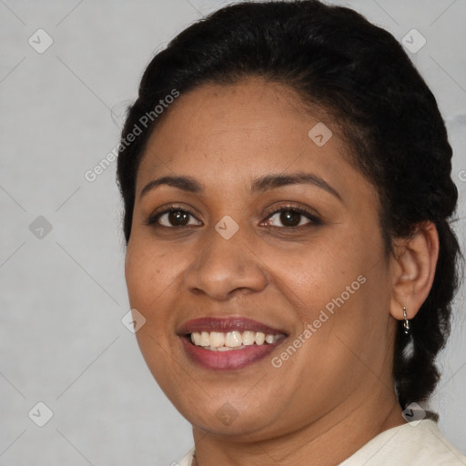 Joyful latino adult female with short  brown hair and brown eyes