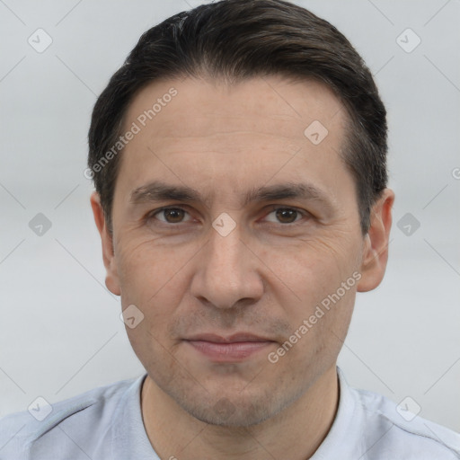 Joyful white adult male with short  brown hair and brown eyes