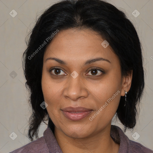 Joyful black adult female with medium  brown hair and brown eyes