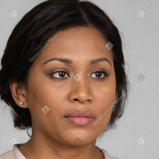 Joyful latino young-adult female with medium  brown hair and brown eyes