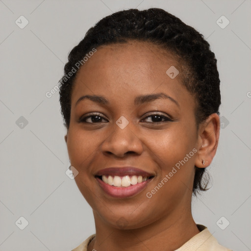 Joyful black young-adult female with short  brown hair and brown eyes