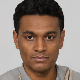 Neutral black young-adult male with short  black hair and brown eyes