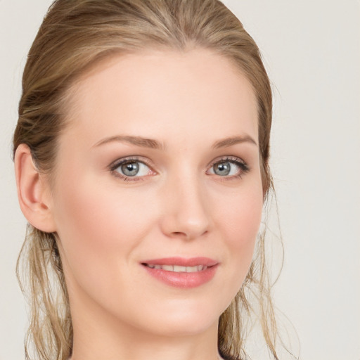 Joyful white young-adult female with long  brown hair and blue eyes