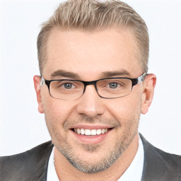 Joyful white adult male with short  brown hair and grey eyes