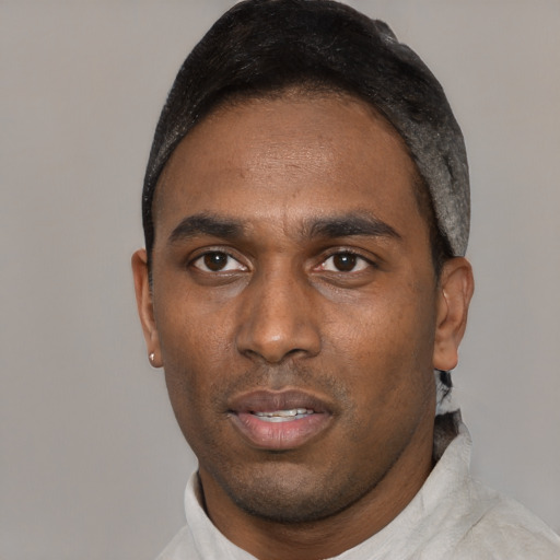 Neutral black young-adult male with short  black hair and brown eyes