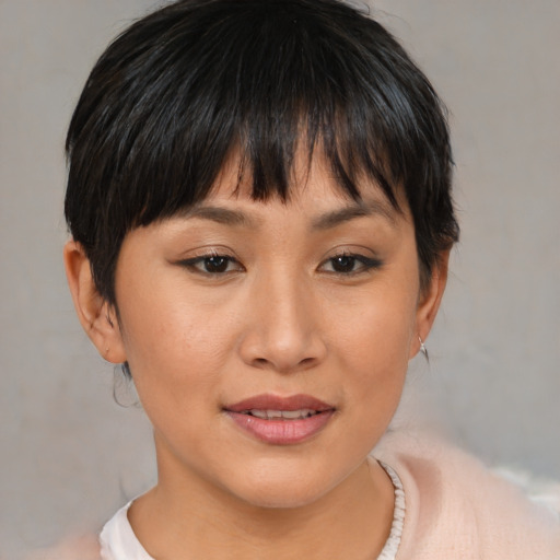 Joyful asian young-adult female with medium  brown hair and brown eyes