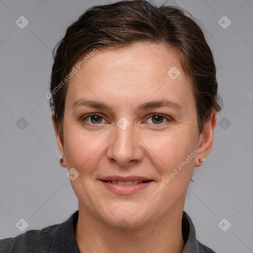 Joyful white adult female with short  brown hair and grey eyes